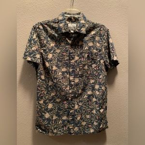 Short sleeve collared shirts with floral prints. Buy one get one half off.